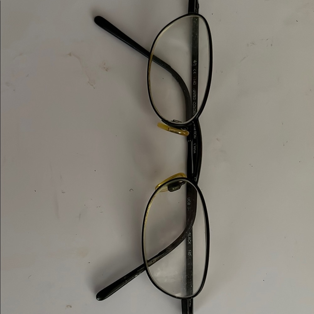 Gold and Black Wire-Frame Glasses with Oval Lenses
